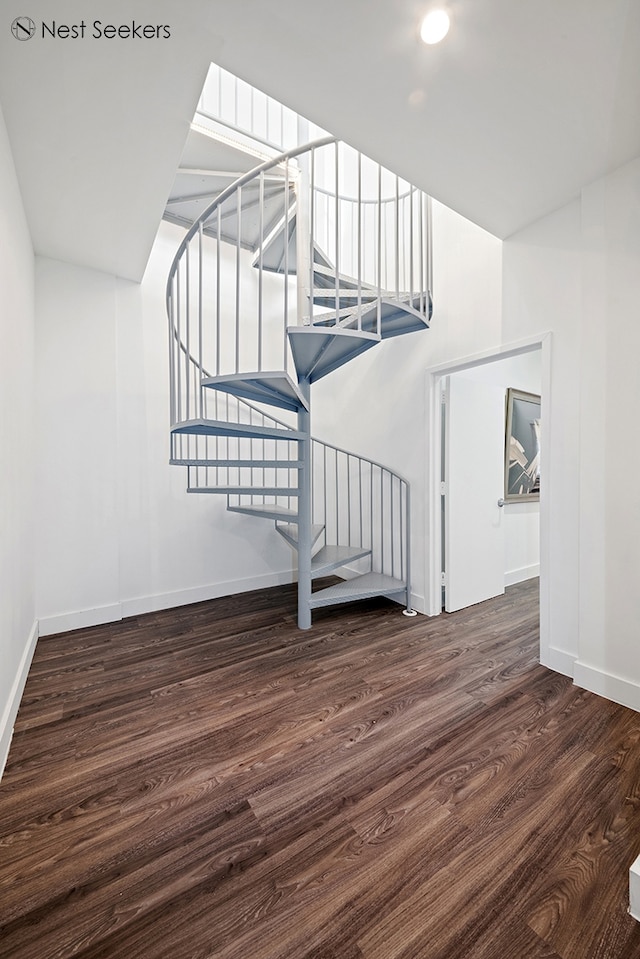 47-05 5th St Unit 203, New York City, NY 11101 - stairs featuring wood finished floors, baseboards, and recessed lighting