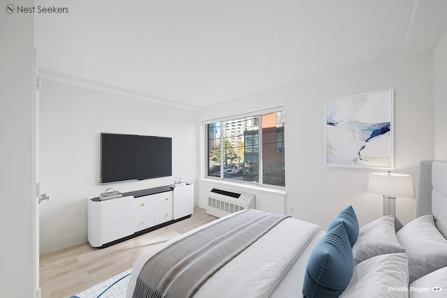 47-05 5th St Unit 203, New York City, NY 11101 - bedroom with wood finished floors and a wall mounted AC