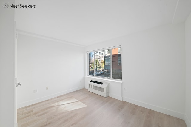 47-05 5th St Unit 203, New York City, NY 11101 - spare room with light wood finished floors and baseboards