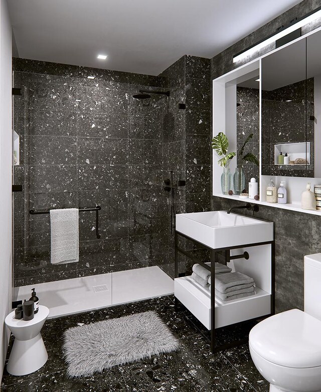 181 E 101st St Unit 809, New York City, NY 10029 - full bathroom with toilet, a walk in shower, tile walls, and a sink