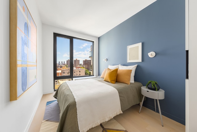 bedroom with light hardwood / wood-style flooring