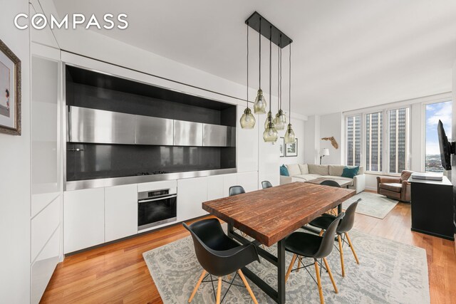 dining space with light wood-type flooring