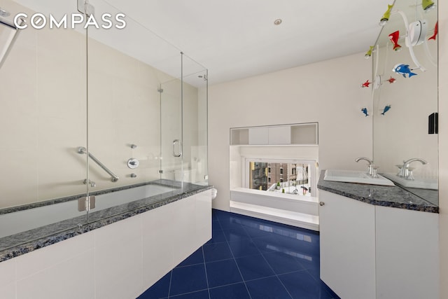 full bath with tiled shower, vanity, a bathing tub, and tile patterned floors