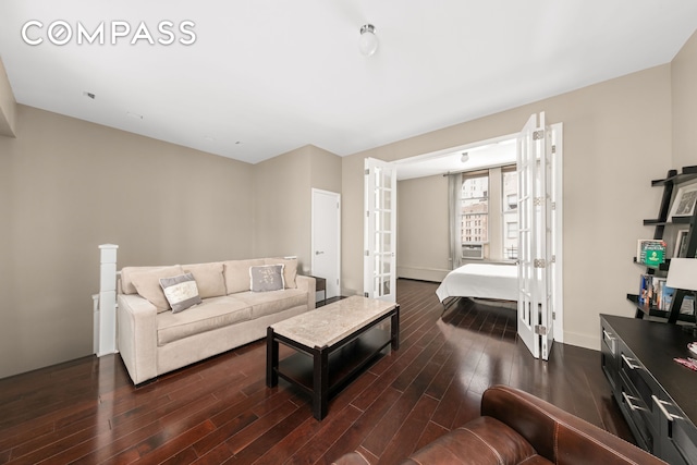 living room with wood finished floors and french doors