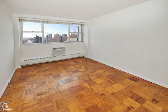 unfurnished room with baseboards, ornamental molding, an AC wall unit, a city view, and baseboard heating