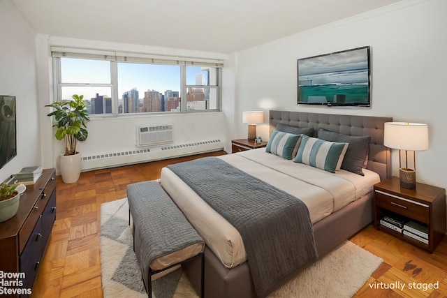 bedroom with a wall mounted air conditioner, baseboard heating, a city view, and ornamental molding