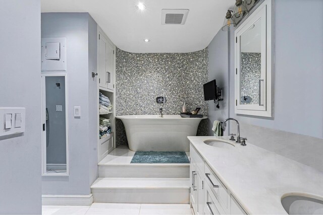 kitchen featuring wine cooler, premium appliances, decorative light fixtures, and white cabinetry