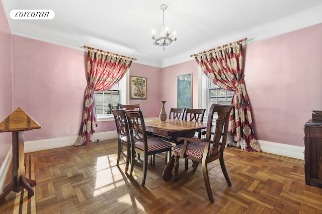 dining room featuring visible vents, baseboards, an inviting chandelier, and ornamental molding