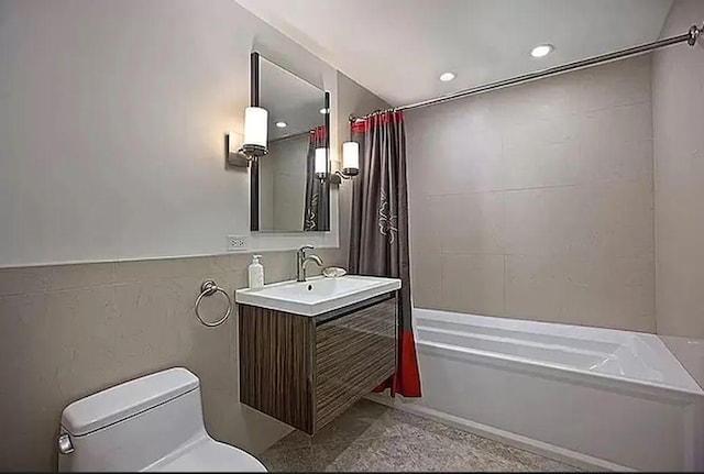 bathroom featuring shower / bath combo and vanity