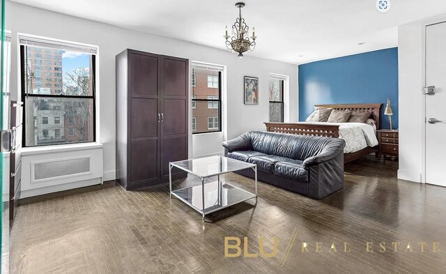 bedroom featuring wood finished floors