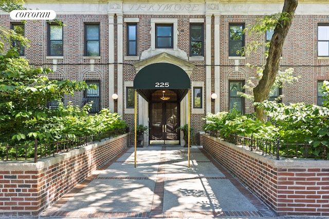 entrance to property with brick siding