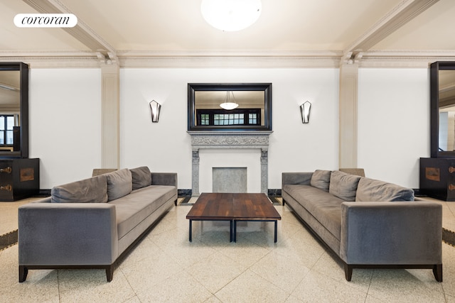 living room featuring crown molding, visible vents, a fireplace, and ornate columns