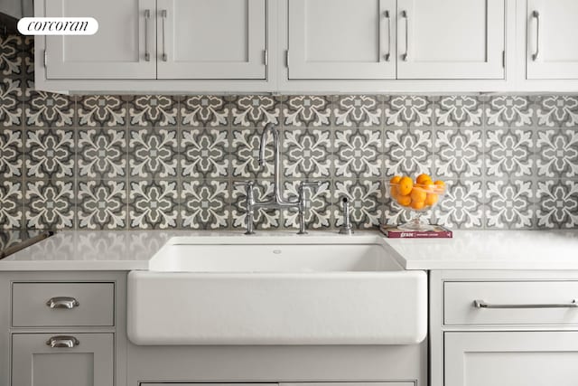 interior space with gray cabinets and a sink