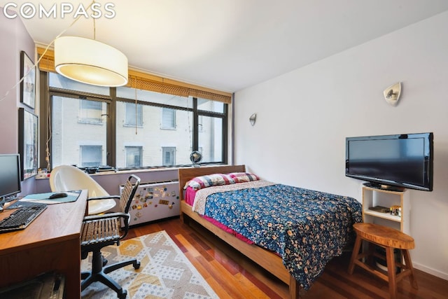 bedroom featuring hardwood / wood-style flooring