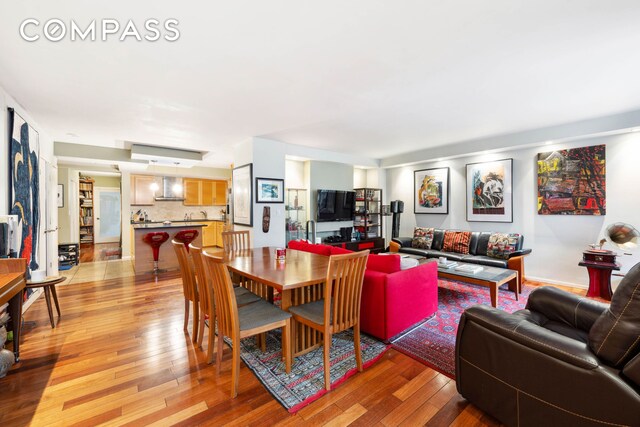 dining space with light hardwood / wood-style floors