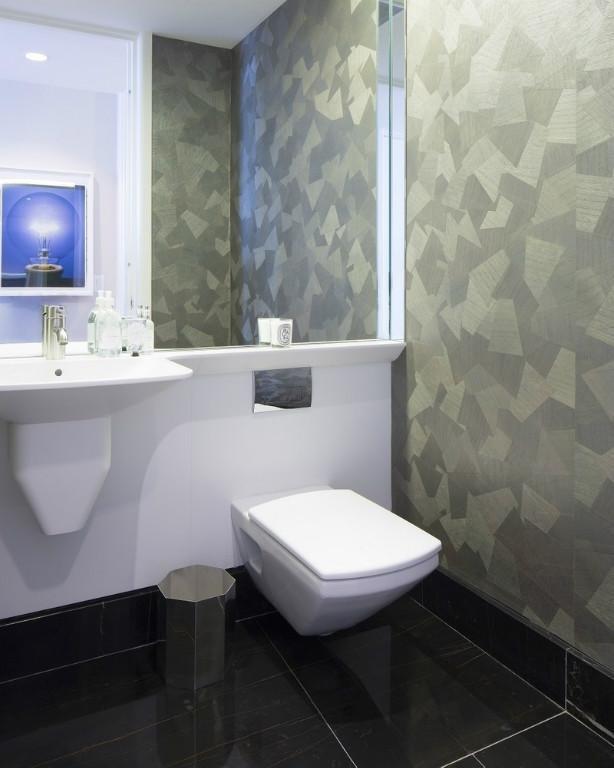 bathroom with tile patterned flooring and toilet