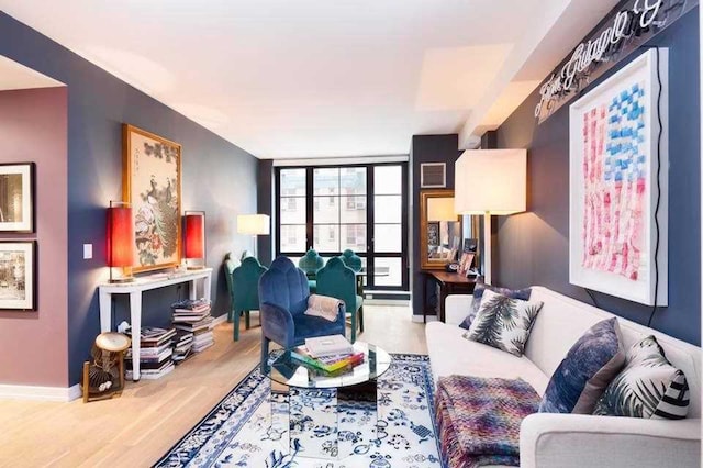 234 E 23rd St Unit 4-A, New York City, NY 10010 - living room featuring wood finished floors and baseboards