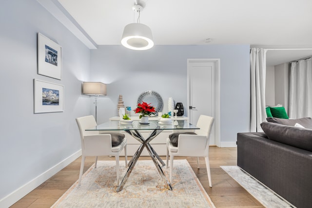 dining space featuring light hardwood / wood-style floors