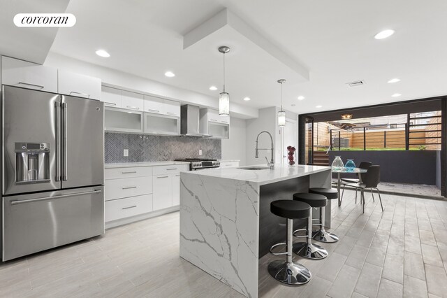 living area featuring light wood finished floors, visible vents, stairway, and recessed lighting