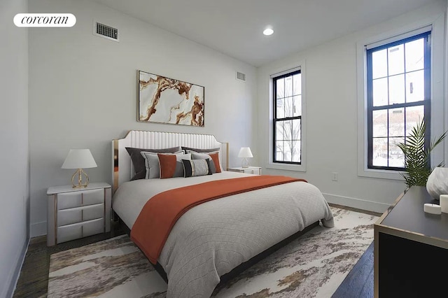 bedroom featuring visible vents, recessed lighting, baseboards, and wood finished floors