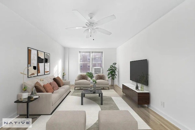 living room featuring ceiling fan and light wood-type flooring