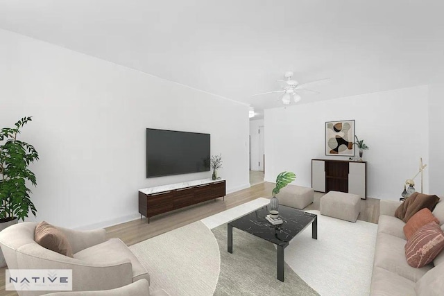 living room featuring ceiling fan and light hardwood / wood-style floors