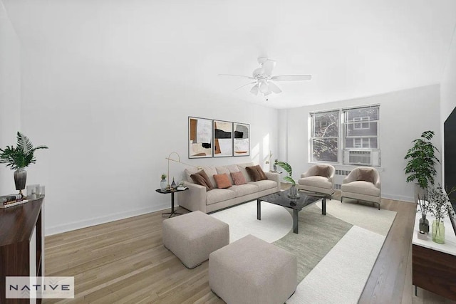 living room with ceiling fan and light hardwood / wood-style floors