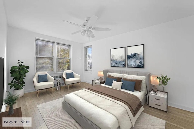 bedroom featuring hardwood / wood-style flooring and ceiling fan