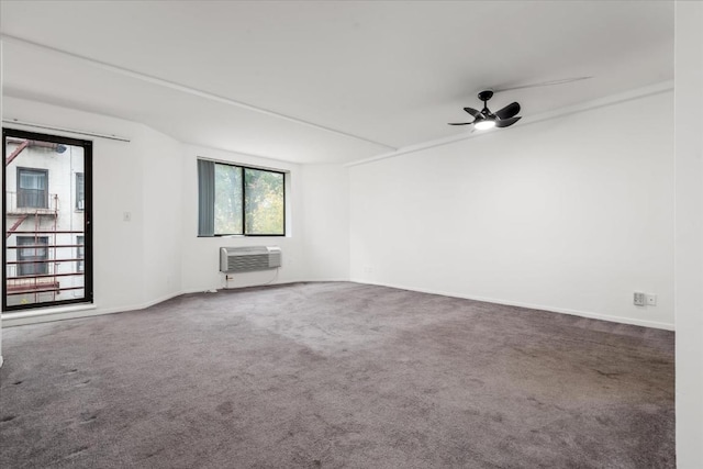 unfurnished room featuring ceiling fan, an AC wall unit, and carpet flooring