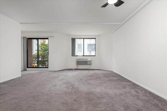 carpeted spare room with ceiling fan and an AC wall unit