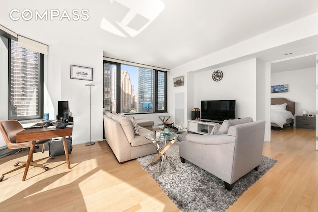 50 United Nations Plz Unit 6C, New York City, NY 10017 - living area with light wood-type flooring and an office area
