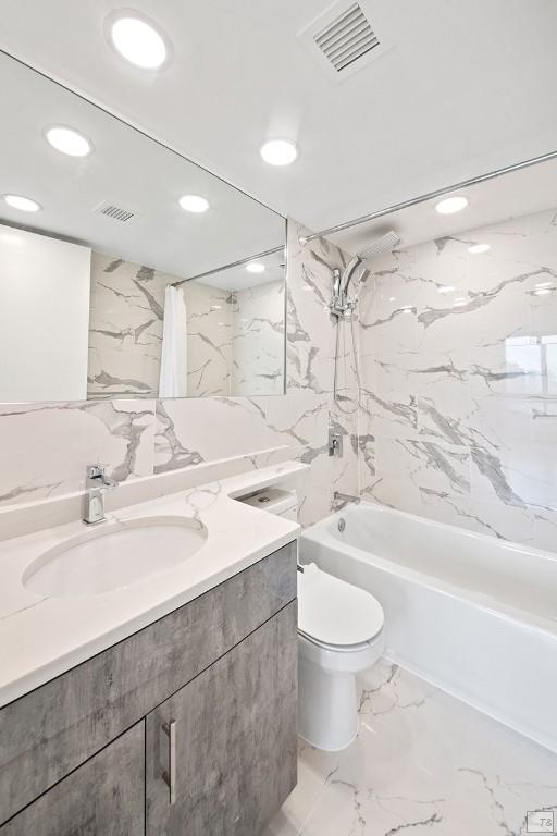 full bathroom featuring vanity, shower / tub combo with curtain, and toilet