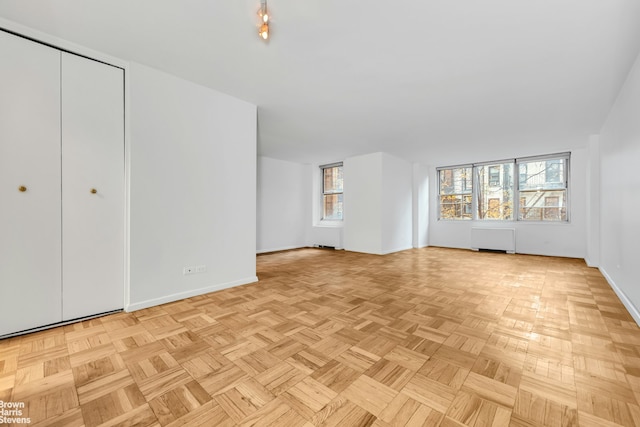 unfurnished bedroom featuring baseboards