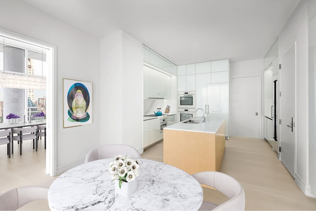 200 E 59th St Unit Ph32, New York City, NY 10022 - dining area featuring light wood finished floors
