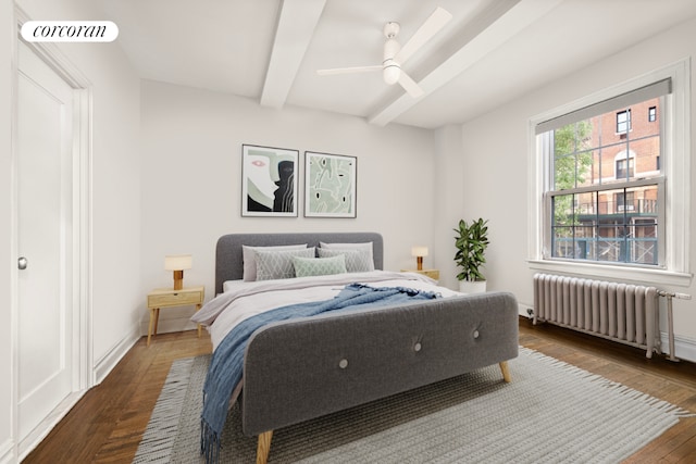 bedroom featuring ceiling fan, dark hardwood / wood-style floors, radiator, and beam ceiling