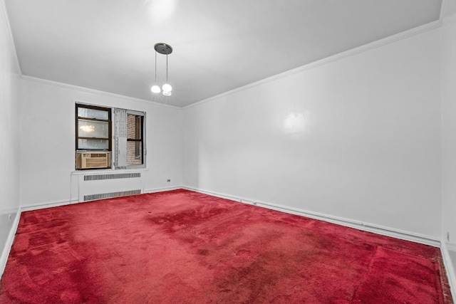 unfurnished room featuring cooling unit, carpet floors, baseboards, ornamental molding, and radiator