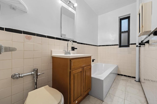 bathroom with marble finish floor, tile walls, toilet, and a bath