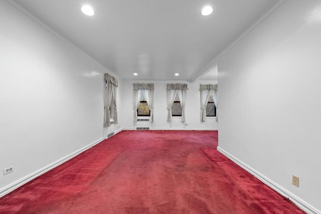 carpeted empty room featuring baseboards, crown molding, and recessed lighting