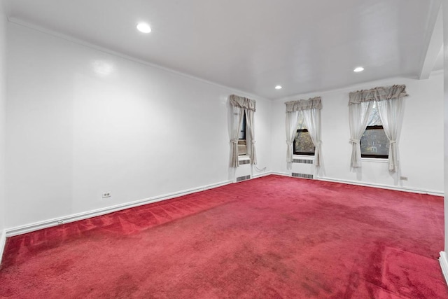 unfurnished living room featuring radiator, baseboards, carpet floors, and recessed lighting