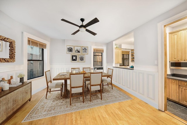 dining area featuring light hardwood / wood-style flooring and ceiling fan