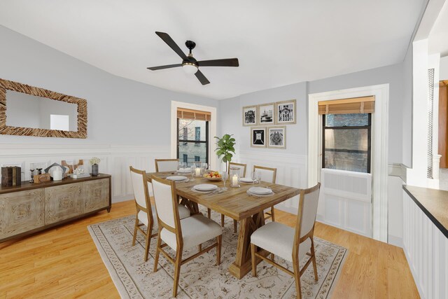 dining space featuring light hardwood / wood-style floors and ceiling fan