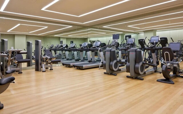 gym with wood finished floors