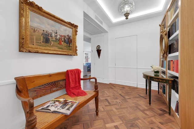 living area with parquet flooring