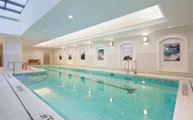 view of pool featuring a skylight