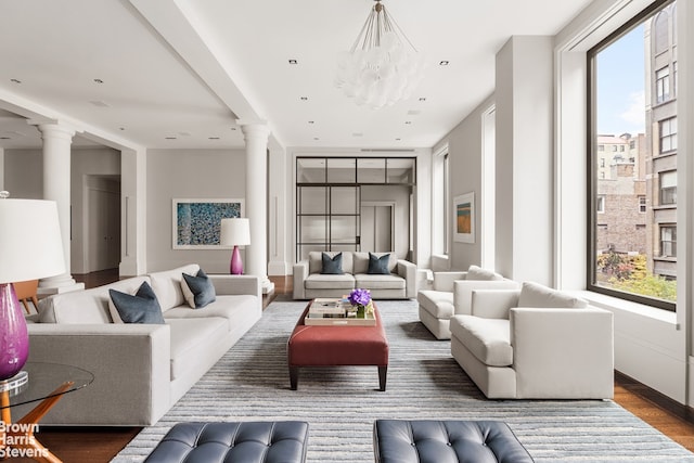 interior space featuring hardwood / wood-style flooring, an inviting chandelier, and a healthy amount of sunlight