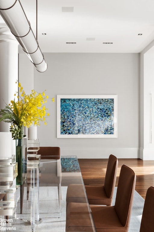 dining area with hardwood / wood-style floors and a wealth of natural light