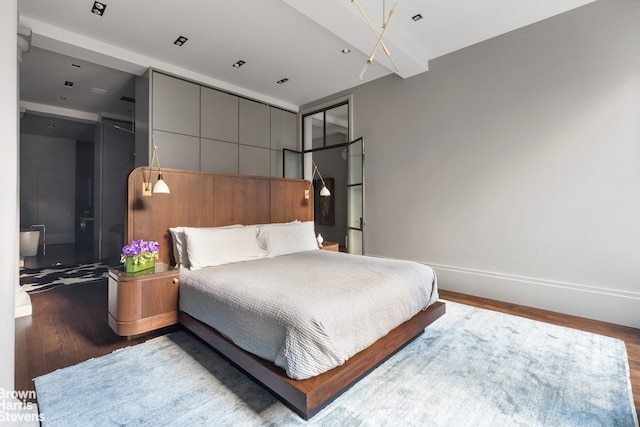 bedroom with hardwood / wood-style floors