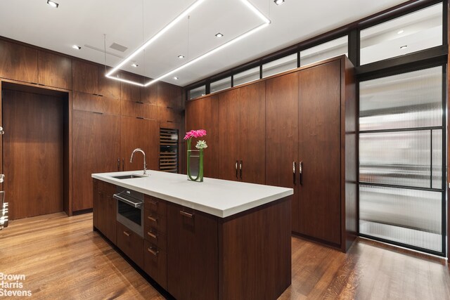 bathroom with hardwood / wood-style flooring, tile walls, vanity, and separate shower and tub