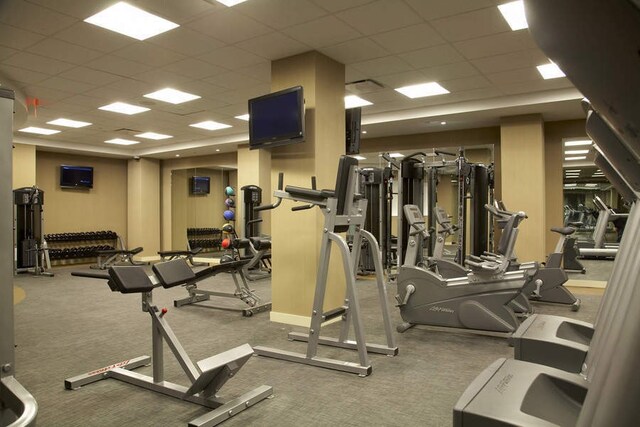 exercise room with a drop ceiling