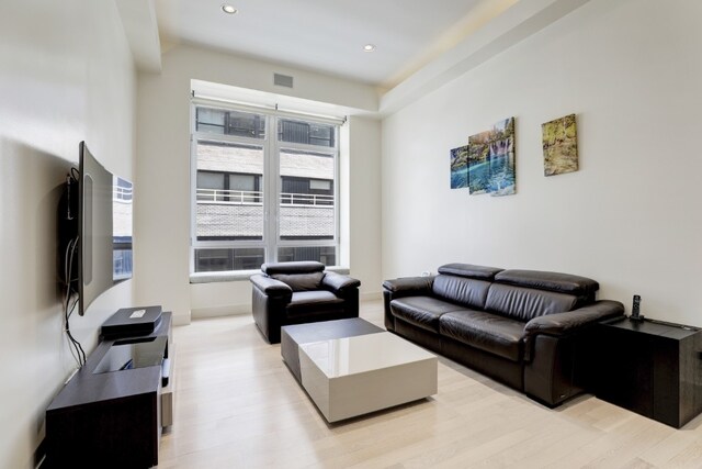 living room with light hardwood / wood-style floors